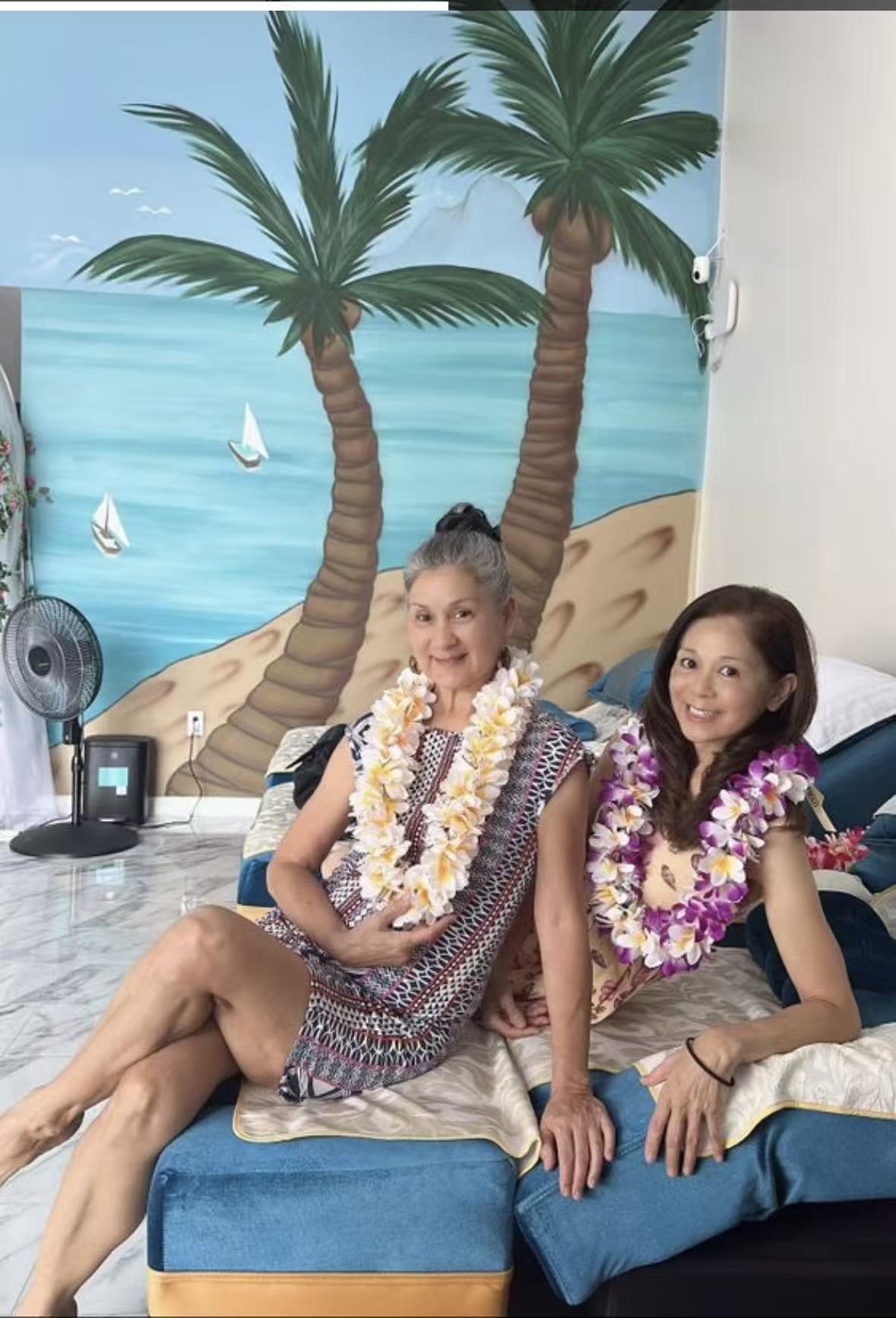Guests relaxing in a treatment room with a Honolulu-inspired mural